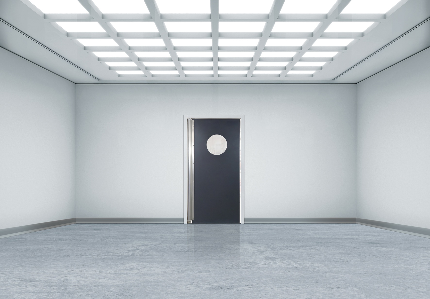 Bright sterile room with grid ceiling lights and a black door with circular window