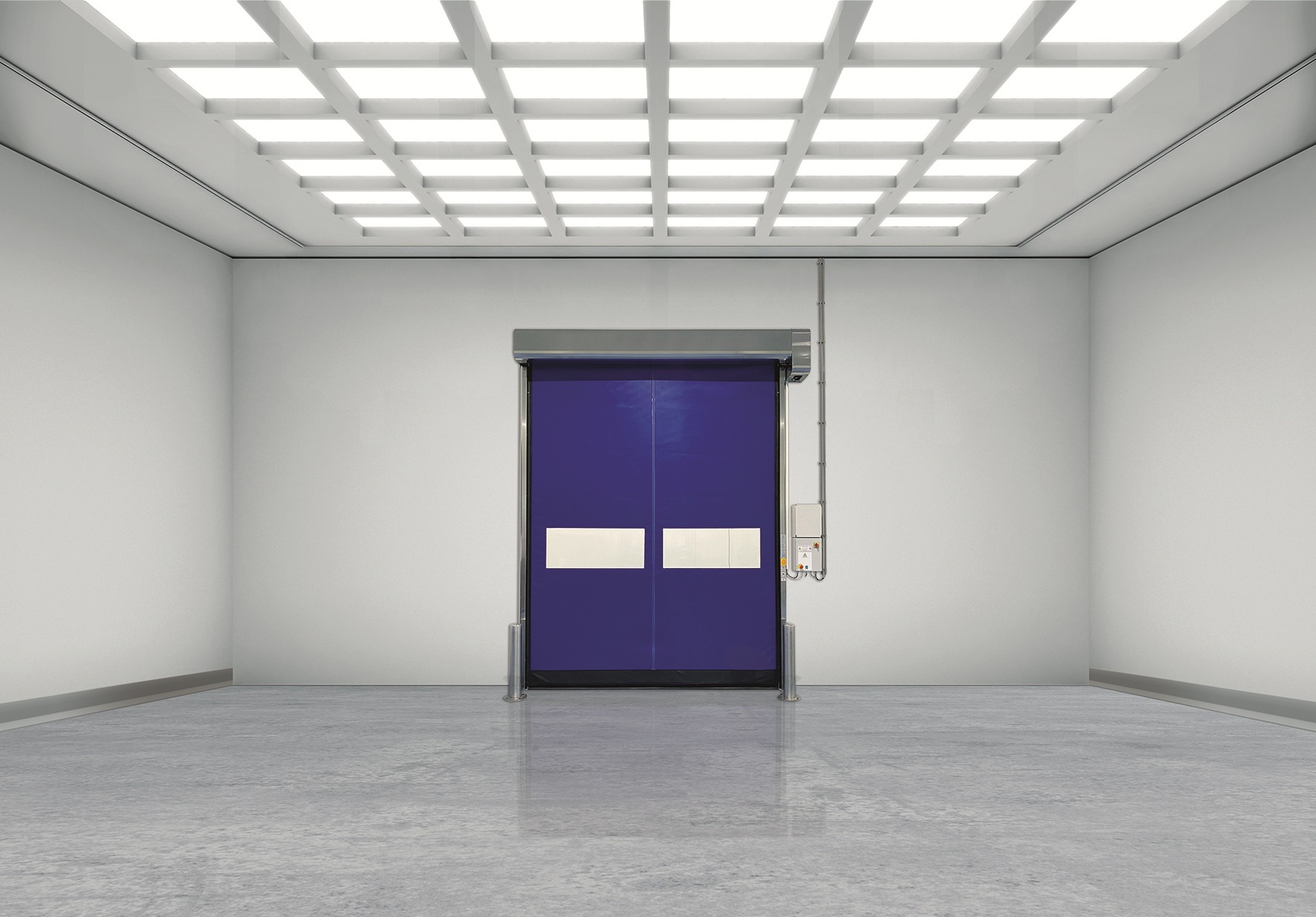 Bright cleanroom with a blue high-speed roll-up door centered