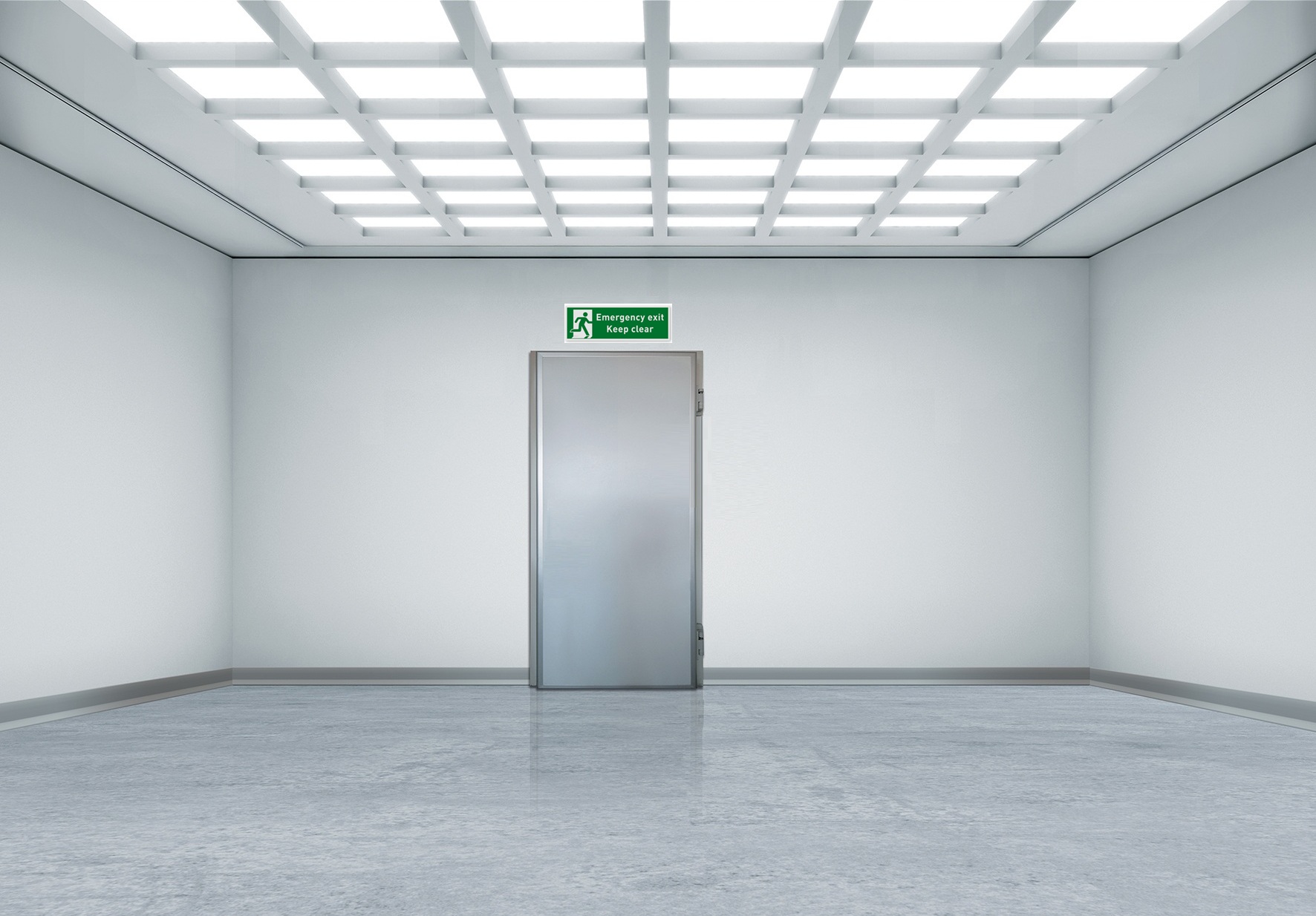 Empty white room with a central metal door and emergency exit sign.