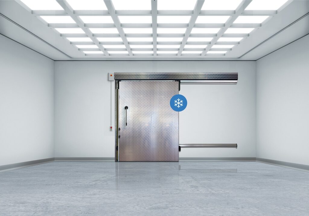 Industrial walk-in freezer with stainless sliding door and snowflake icon